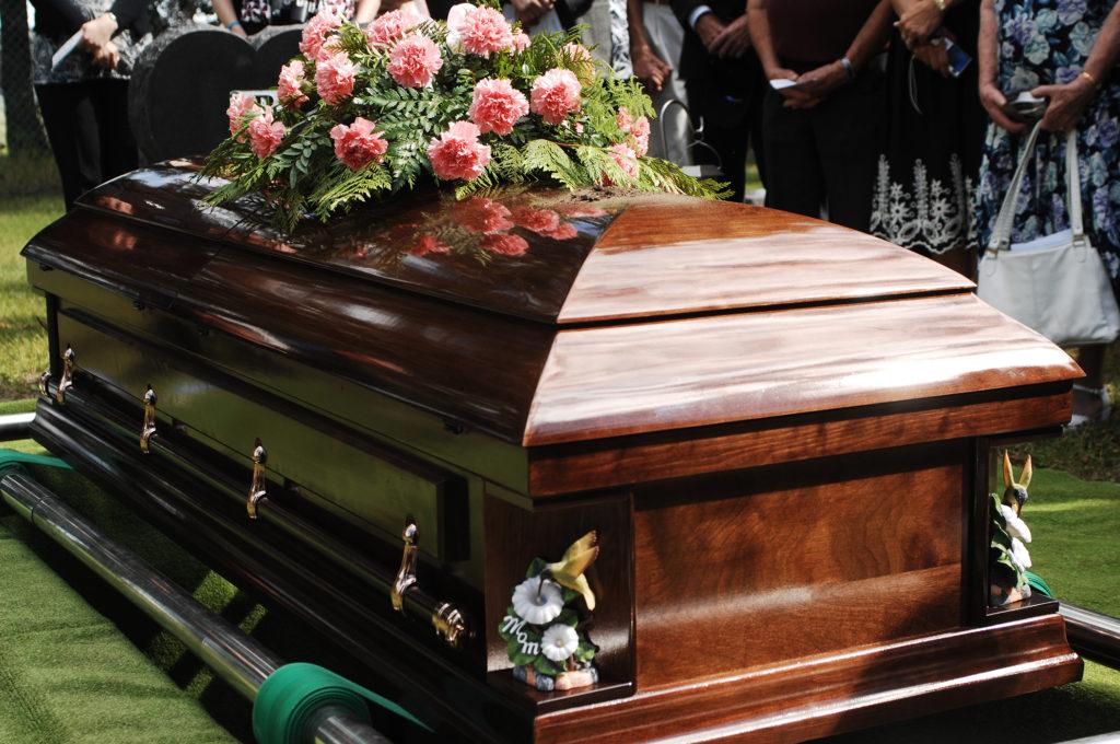 Coffin being lowered