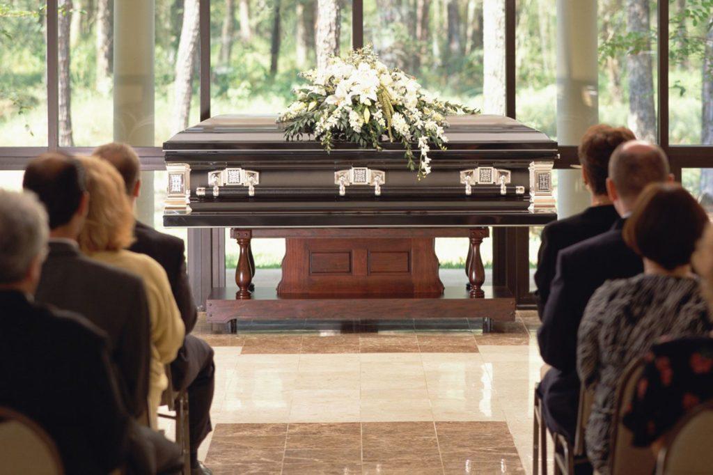 Coffin at the centre of ceremony